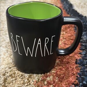 Rae Dunn Black Beware Mug with Bright Green Inside white lettering